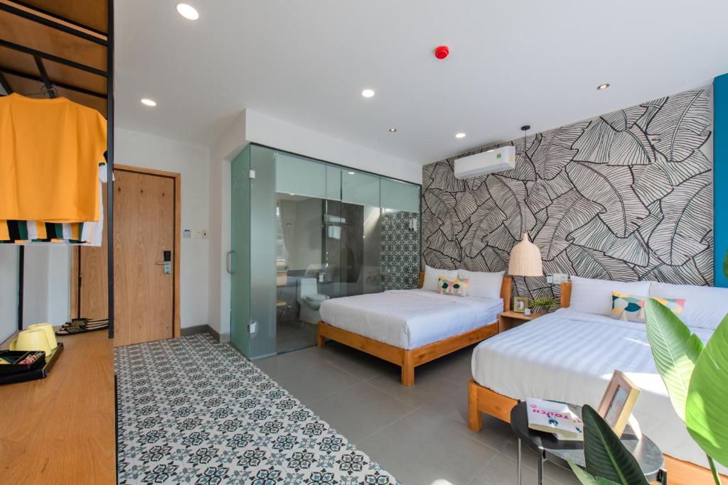 Postel nebo postele na pokoji v ubytování Shoho Hotel Nha Trang