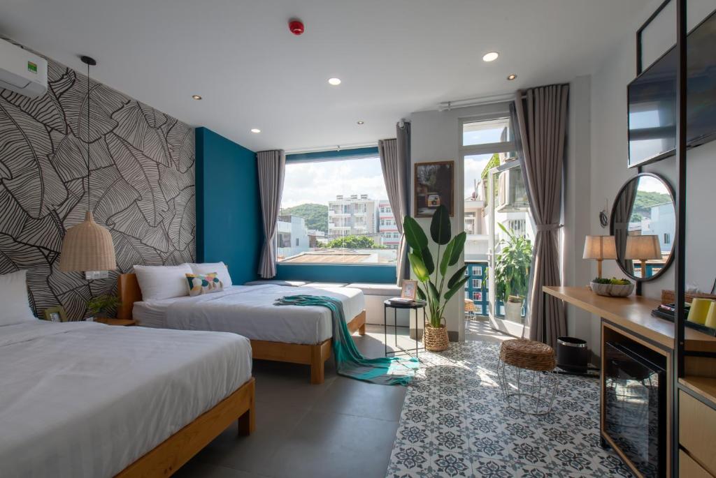 Postel nebo postele na pokoji v ubytování Shoho Hotel Nha Trang