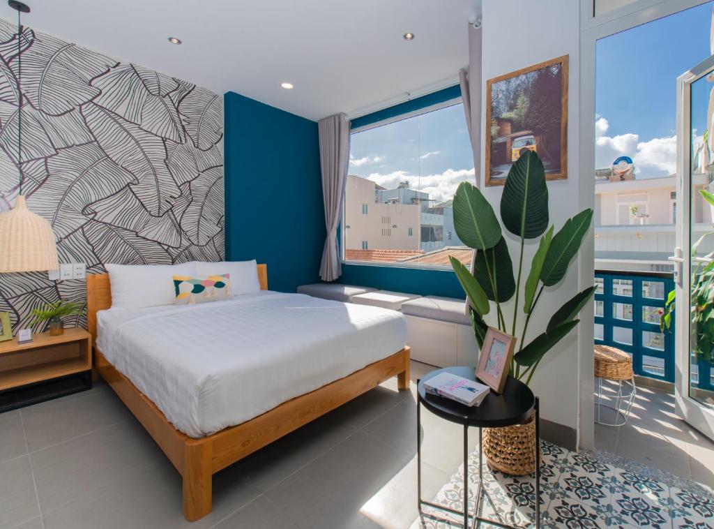 Postel nebo postele na pokoji v ubytování Shoho Hotel Nha Trang