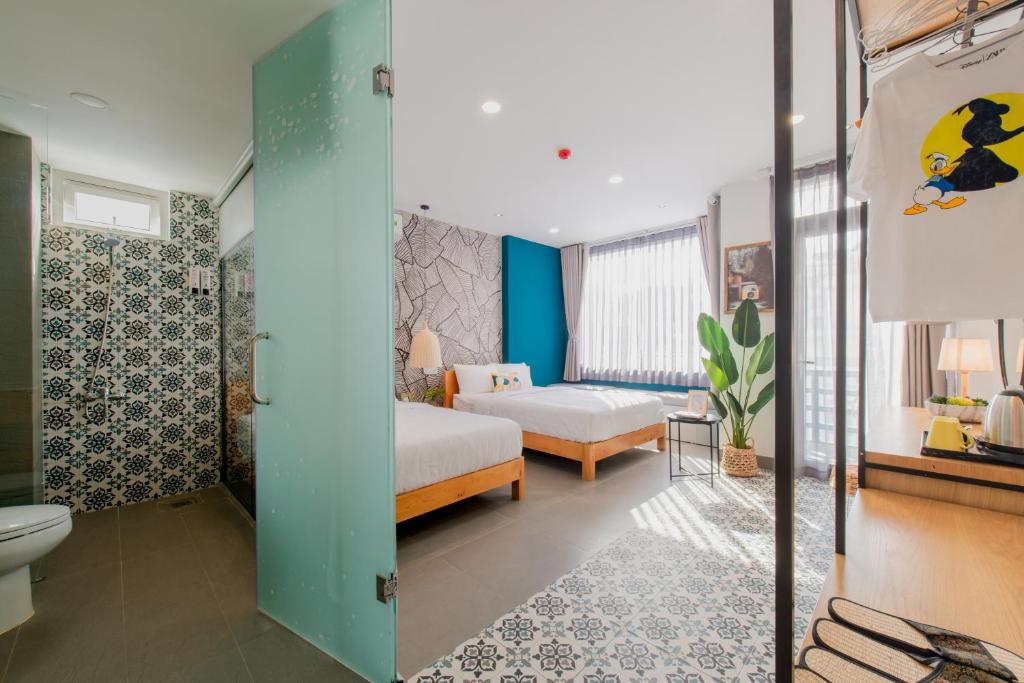 Postel nebo postele na pokoji v ubytování Shoho Hotel Nha Trang