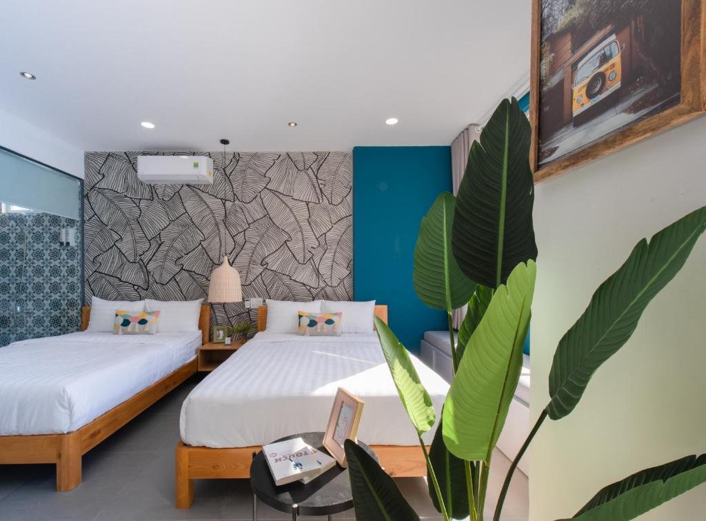 Postel nebo postele na pokoji v ubytování Shoho Hotel Nha Trang