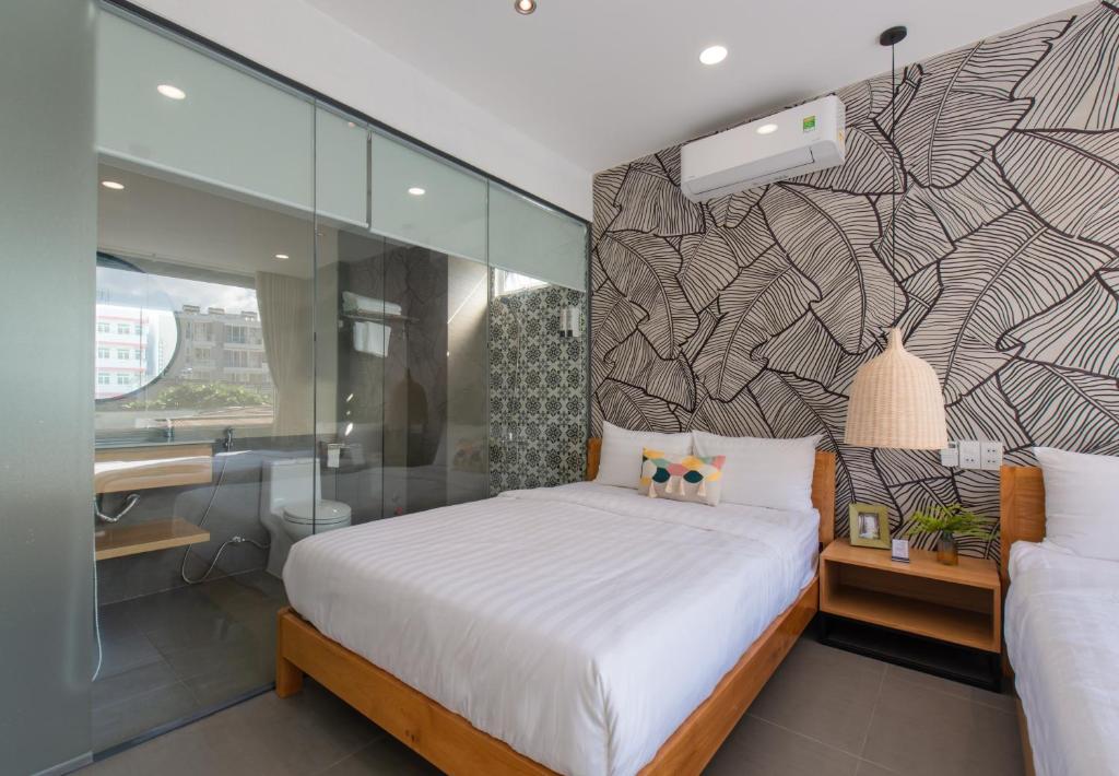 Postel nebo postele na pokoji v ubytování Shoho Hotel Nha Trang