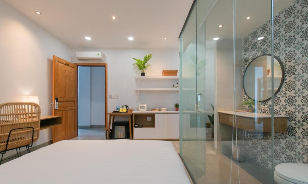 Postel nebo postele na pokoji v ubytování Shoho Hotel Nha Trang
