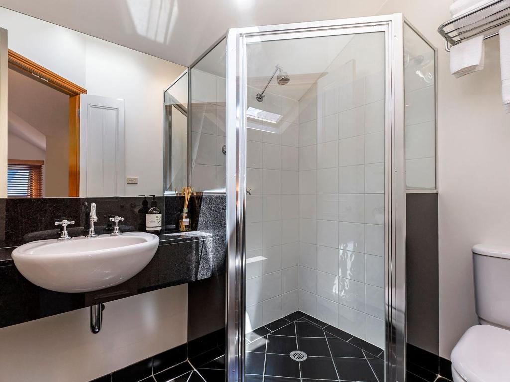 a bathroom with a sink and a shower at Central Starboard in Port Fairy