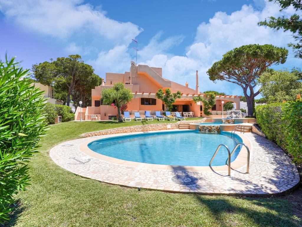 a swimming pool in the yard of a house at Wonderful villa in Vilamoura with barbecue and private swimming pool in Vilamoura