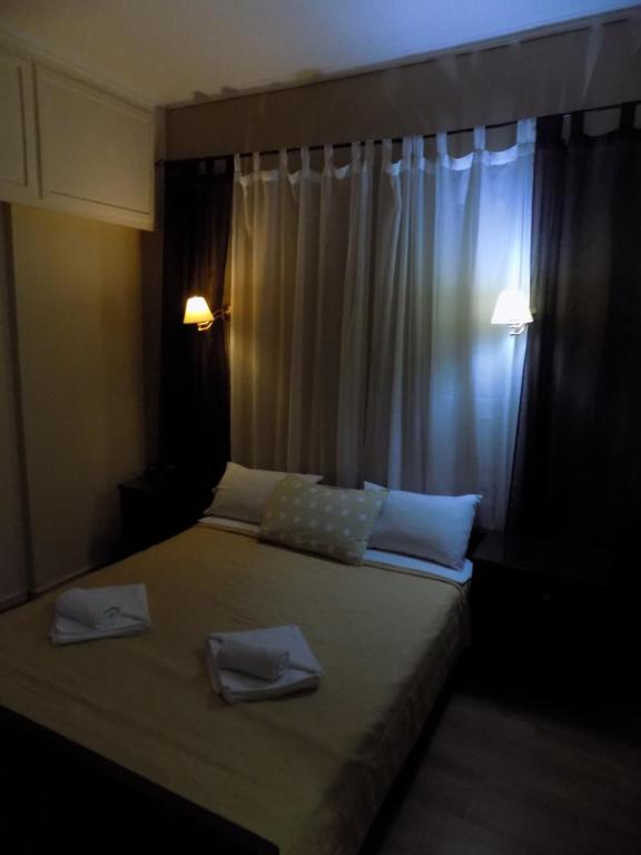 Postel nebo postele na pokoji v ubytování Hotel King Pyrros