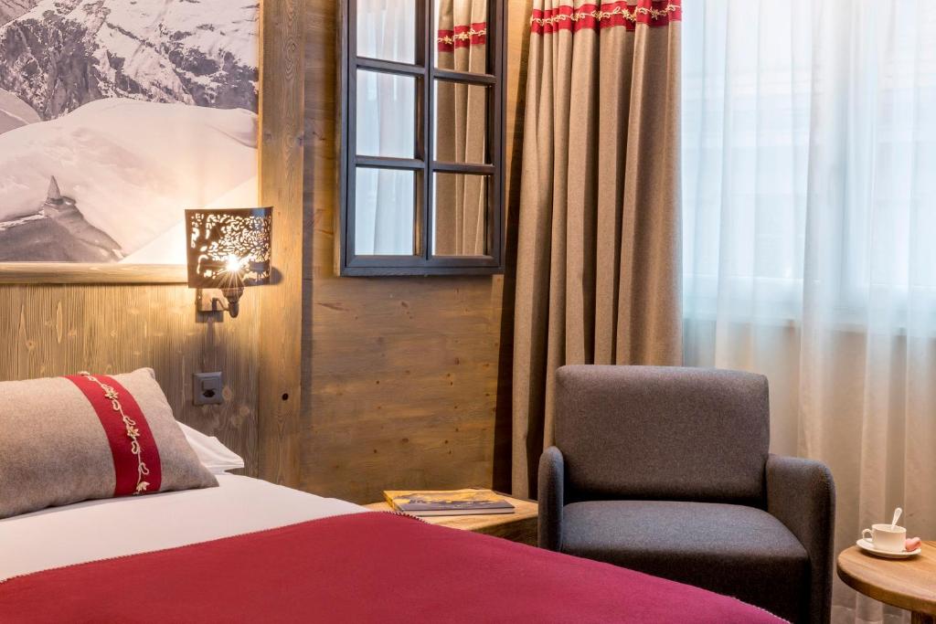 Postel nebo postele na pokoji v ubytování Edelweiss Manotel
