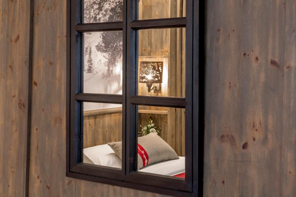 Postel nebo postele na pokoji v ubytování Edelweiss Manotel