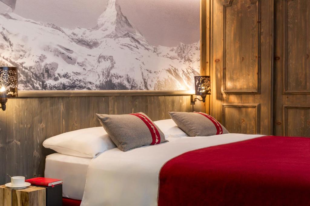 Postel nebo postele na pokoji v ubytování Edelweiss Manotel