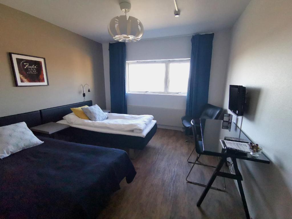 Postel nebo postele na pokoji v ubytování Hotel Tingsryd