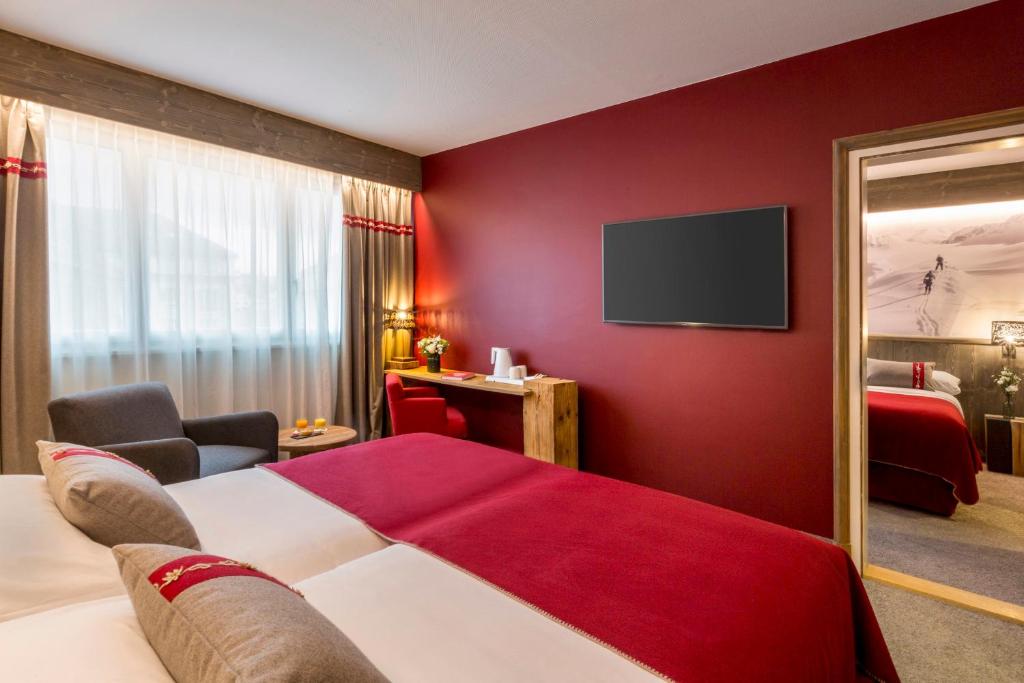 Postel nebo postele na pokoji v ubytování Edelweiss Manotel