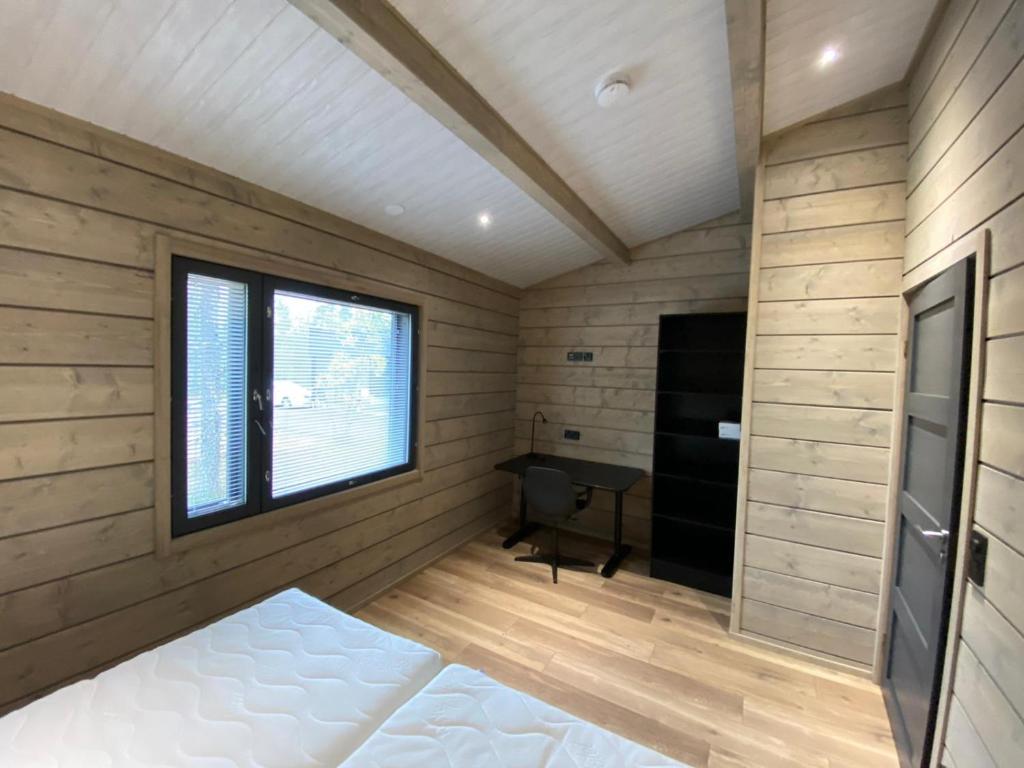Кровать или кровати в номере Villas Karhunpesä