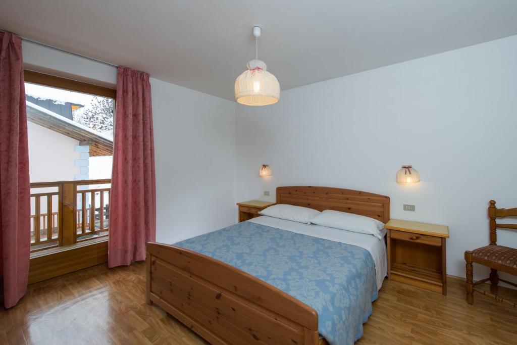 Łóżko lub łóżka w pokoju w obiekcie Residence Villa Boschetto
