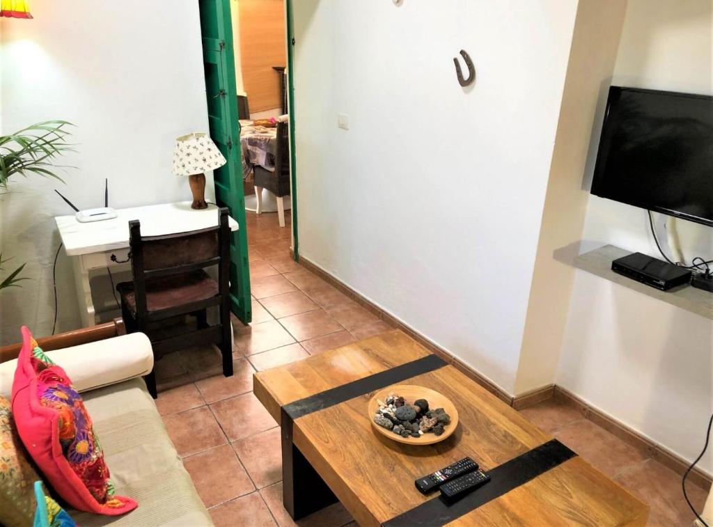 Televízia a/alebo spoločenská miestnosť v ubytovaní Casa vacacional Buganvilla
