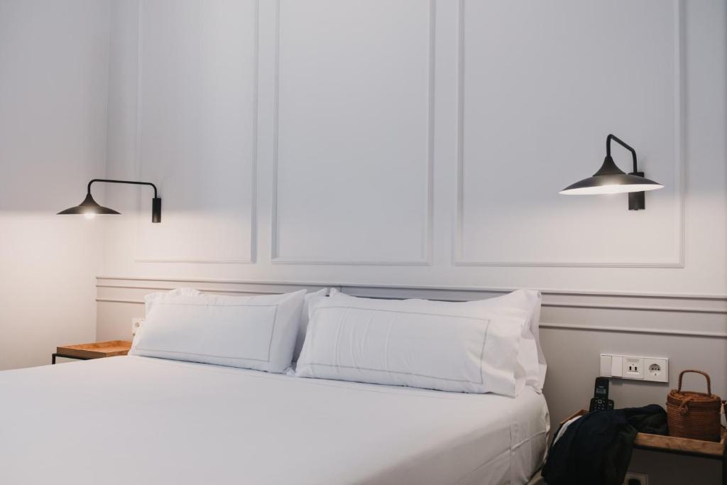 Postel nebo postele na pokoji v ubytování Helen Berger Boutique Hotel