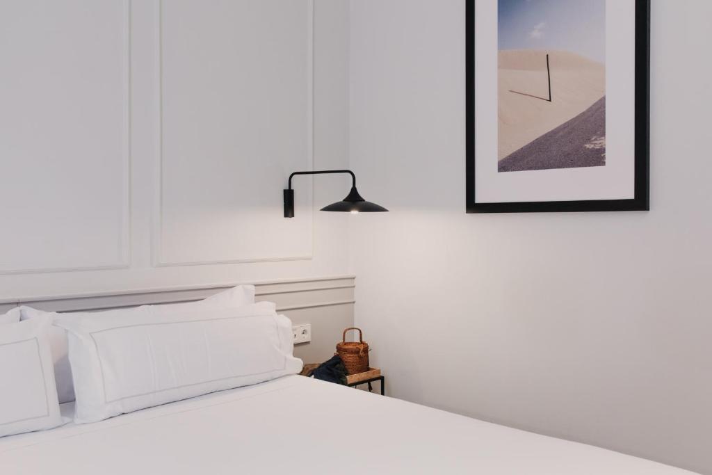 Postel nebo postele na pokoji v ubytování Helen Berger Boutique Hotel
