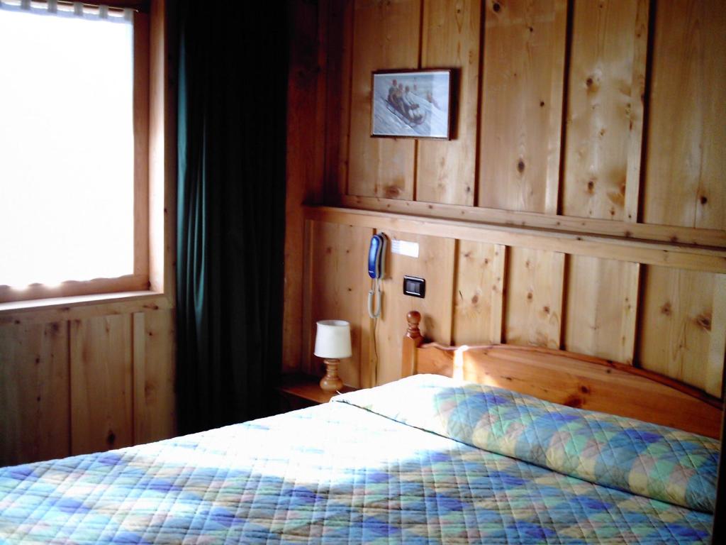 Postel nebo postele na pokoji v ubytování Albergo Rendola