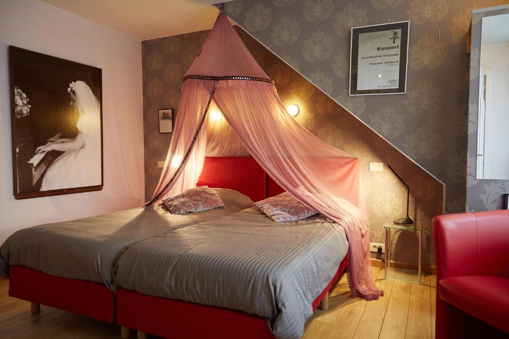 Postel nebo postele na pokoji v ubytování Focus Hotel