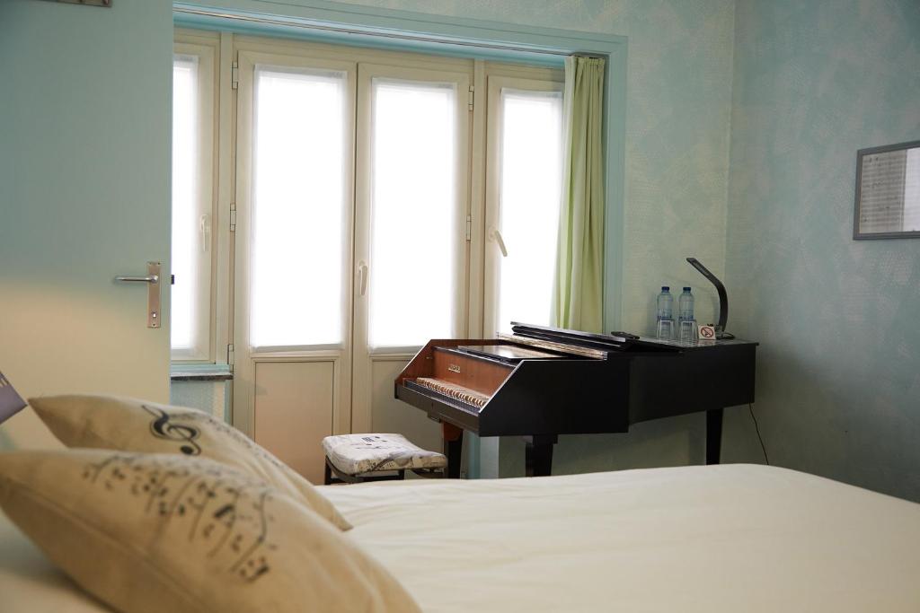 Postel nebo postele na pokoji v ubytování Focus Hotel