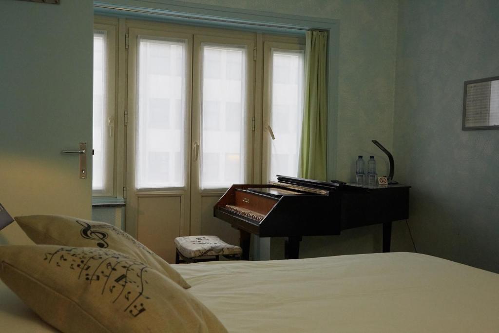 Postel nebo postele na pokoji v ubytování Focus Hotel