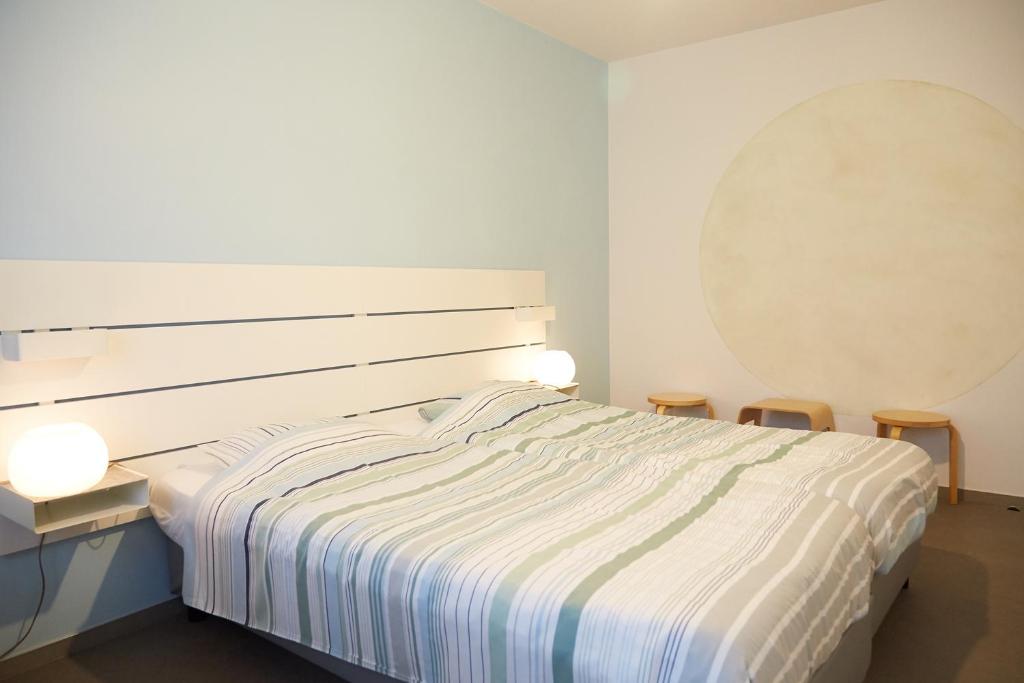 Postel nebo postele na pokoji v ubytování Focus Hotel