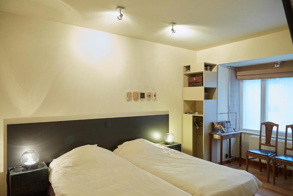 Postel nebo postele na pokoji v ubytování Focus Hotel