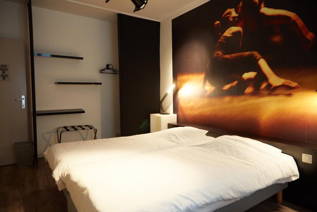 Postel nebo postele na pokoji v ubytování Focus Hotel