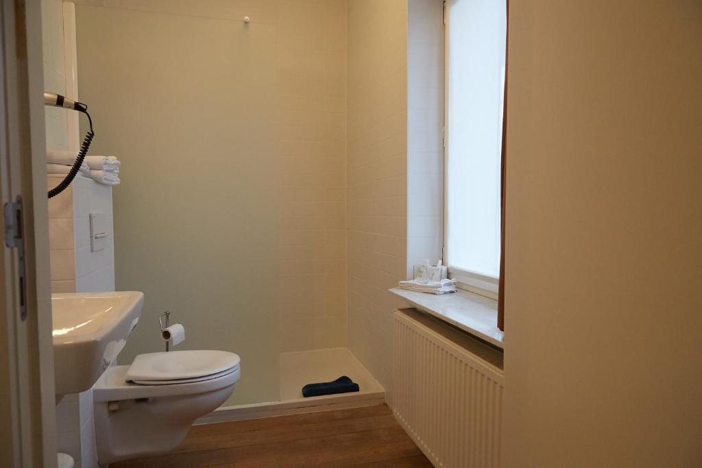 Koupelna v ubytování Focus Hotel