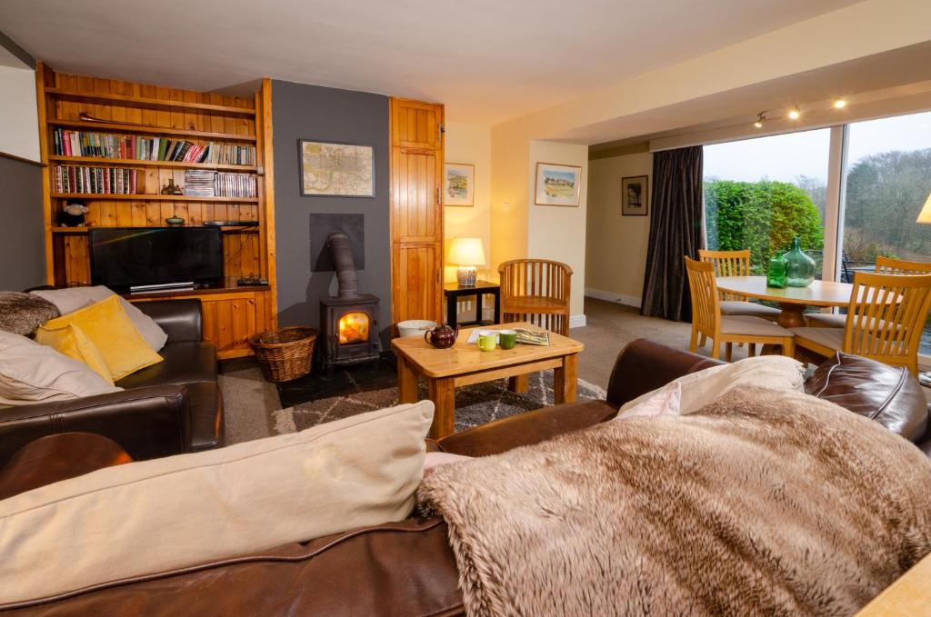 a living room with a couch and a table at Langdale Retreat in Chapel Stile