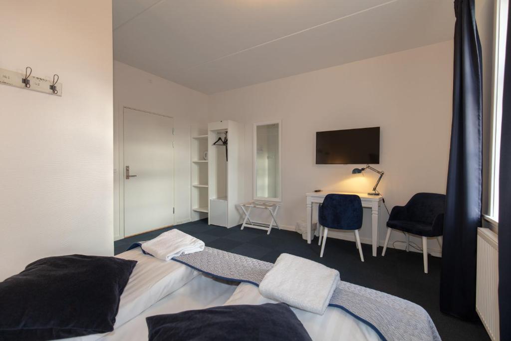 Postel nebo postele na pokoji v ubytování Skagen Hotel