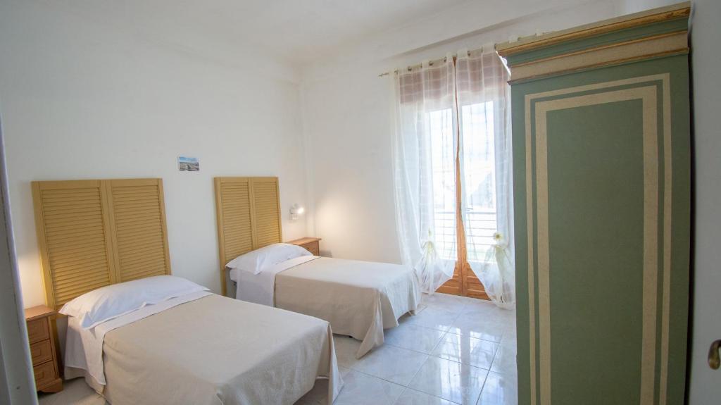 Кровать или кровати в номере VILLA SALINA MONACI