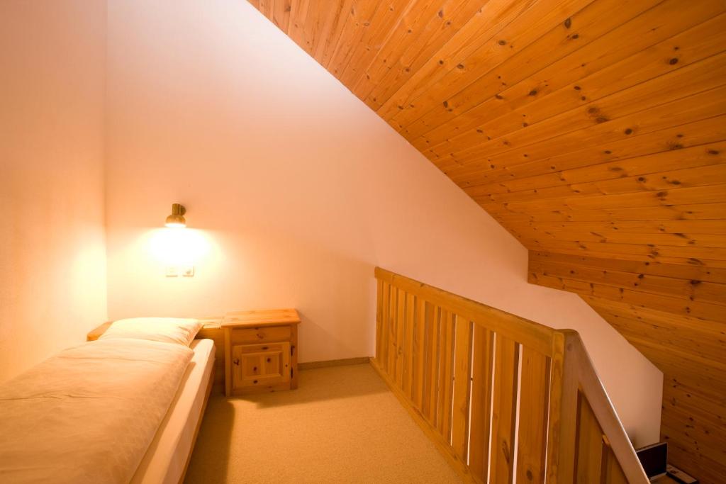Postel nebo postele na pokoji v ubytování Hotel Laaxerhof