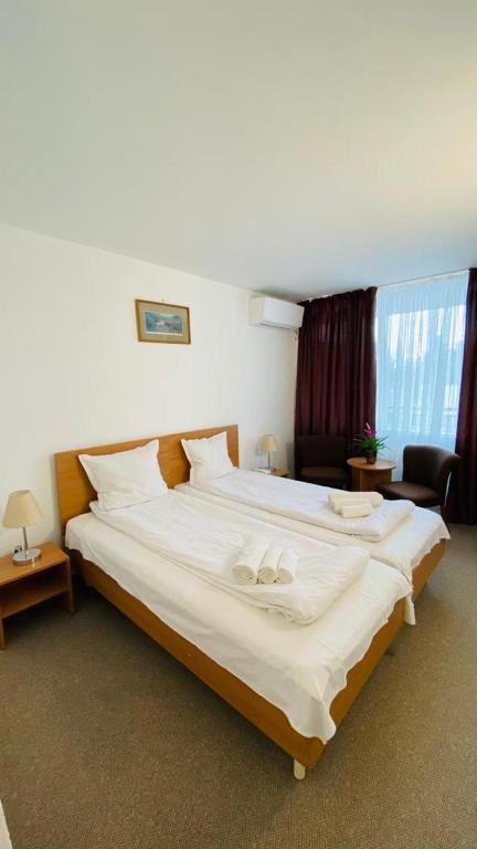 Postel nebo postele na pokoji v ubytování Hotel Neko