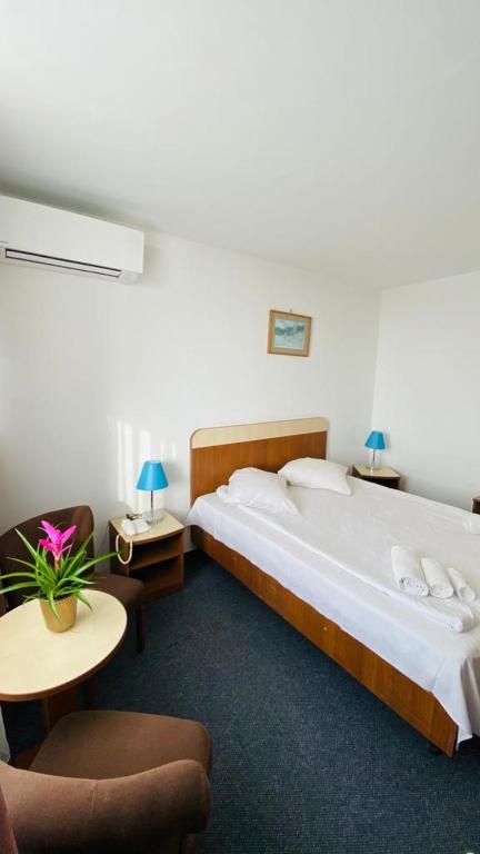 Postel nebo postele na pokoji v ubytování Hotel Neko