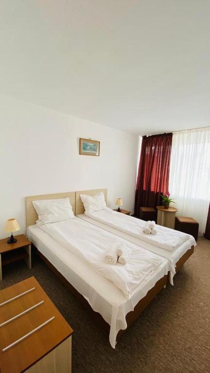 Postel nebo postele na pokoji v ubytování Hotel Neko