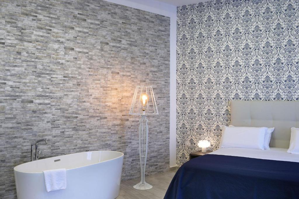 Postel nebo postele na pokoji v ubytování Barbarella Spa