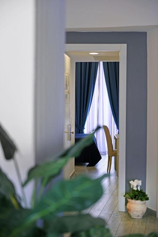 Postel nebo postele na pokoji v ubytování Barbarella Spa