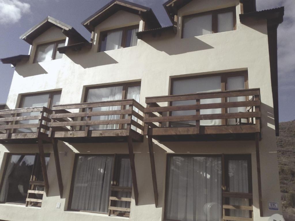 a building with balconies on the side of it at Departamento Piedra del Condor in San Carlos de Bariloche