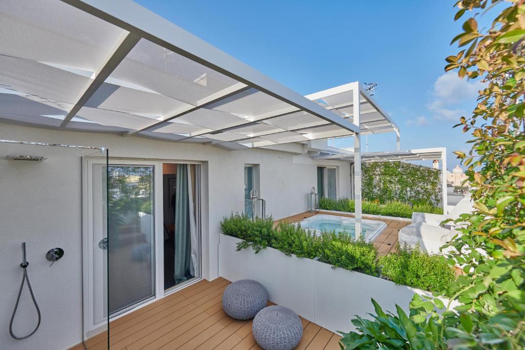 a modern house with a pool and a patio at Musae Relais & SPA in Polignano a Mare