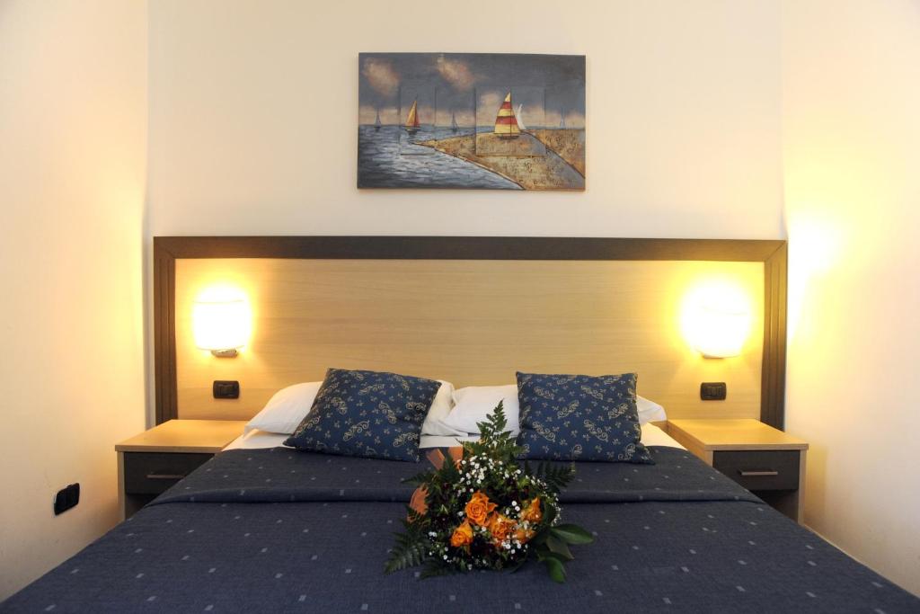 Postel nebo postele na pokoji v ubytování Hotel La Quercia
