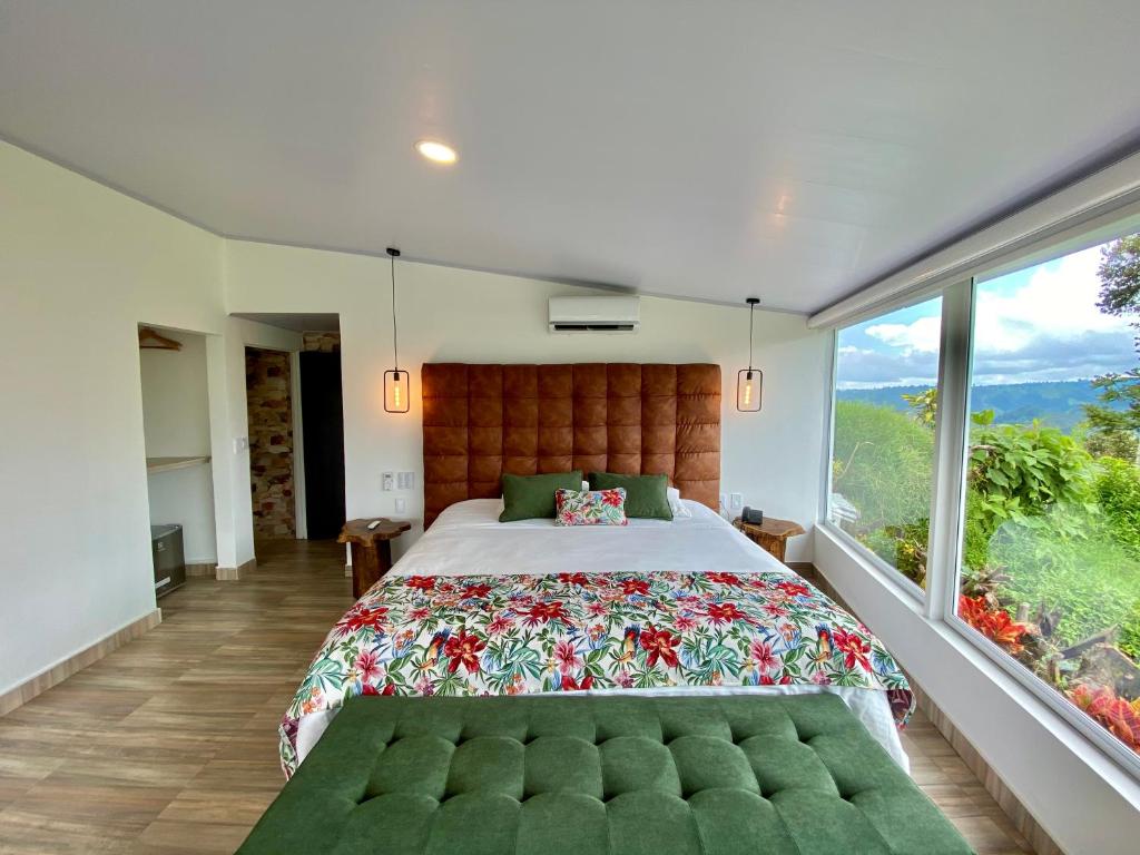 Cama o camas de una habitación en Hotel El Mirador del Cocora