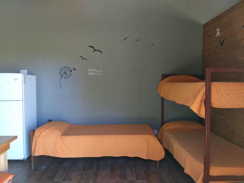 Ένα ή περισσότερα κρεβάτια σε δωμάτιο στο complejo el paraiso 2