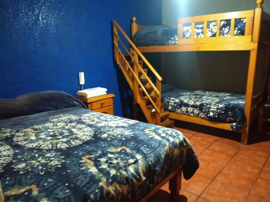 Postel nebo postele na pokoji v ubytování Hotel Plaza Mazamitla