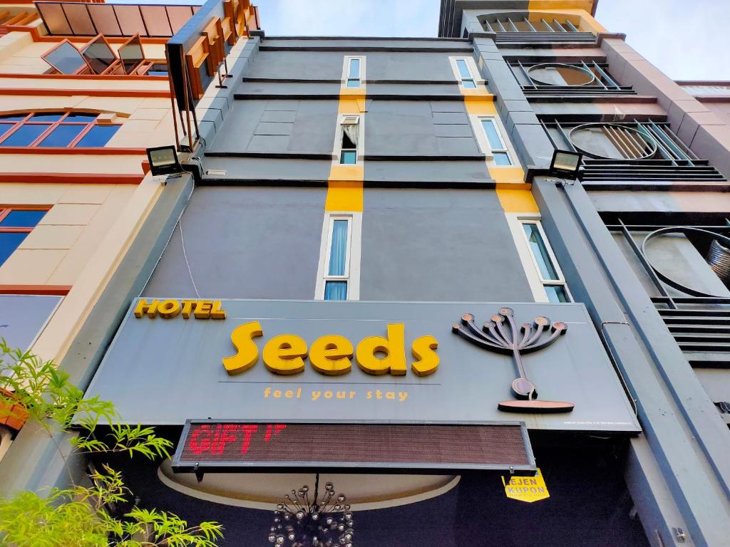 a sign on the side of a building at Seeds Hotel Setia Wangsa in Kuala Lumpur