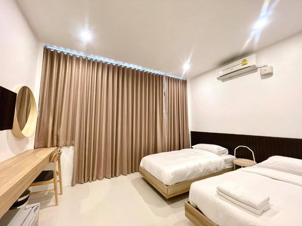 Postel nebo postele na pokoji v ubytování Topnorth Hotel Maesai
