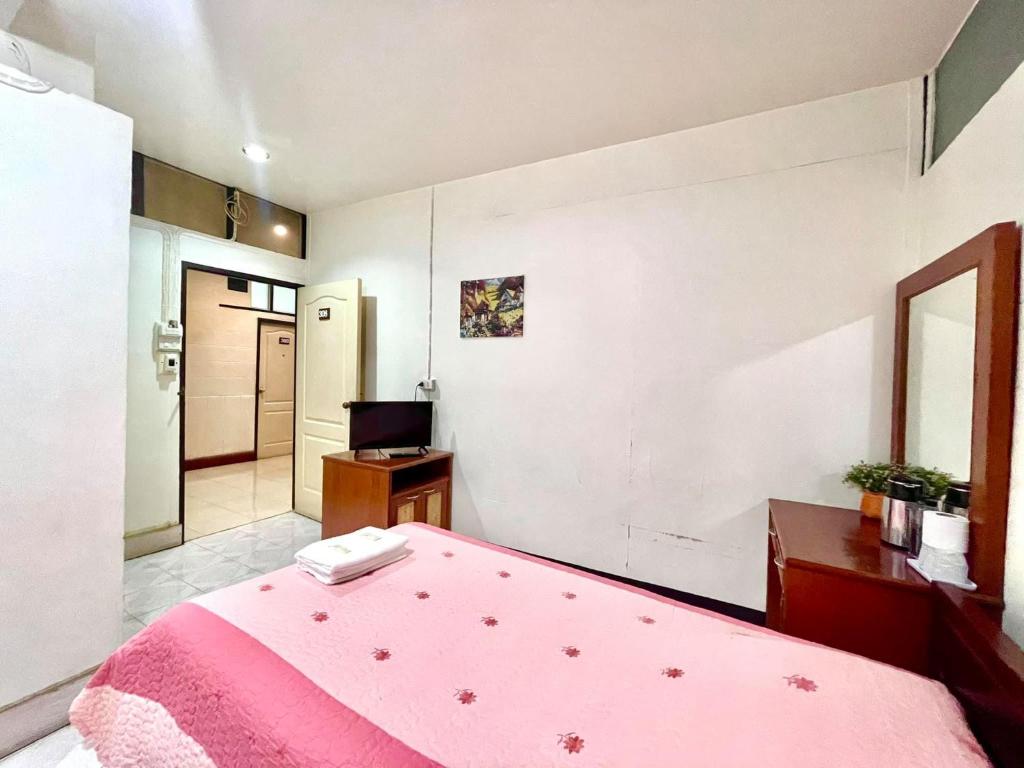 Postel nebo postele na pokoji v ubytování Topnorth Hotel Maesai