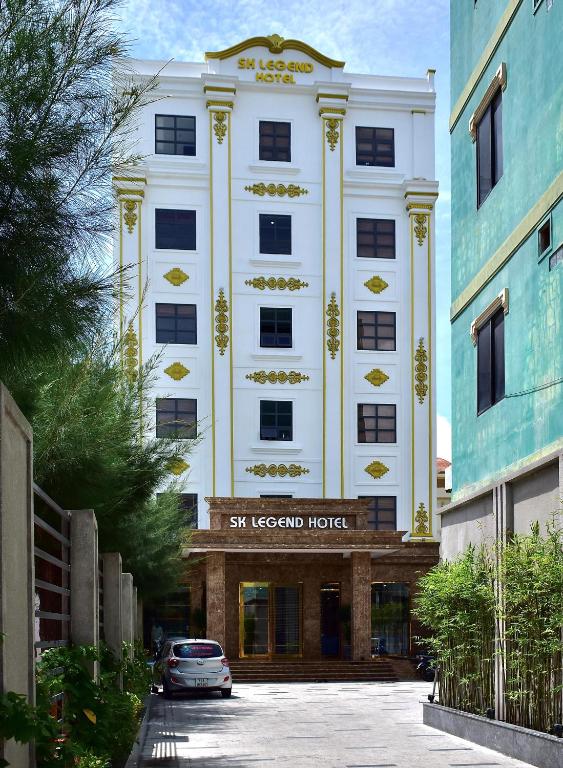 a white building with a sign for a hotel at SK LEGEND VUNG TAU HOTEL in Vung Tau