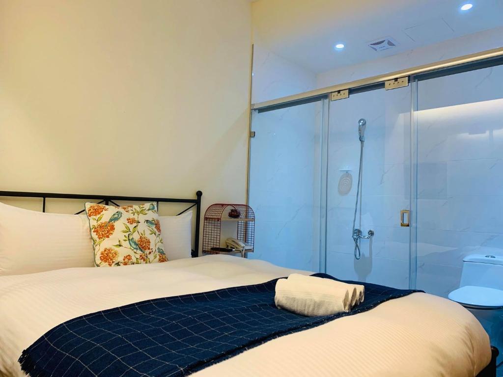 Postel nebo postele na pokoji v ubytování 日月潭沅居民宿 YUAN JU BOUTIQUE Hotel