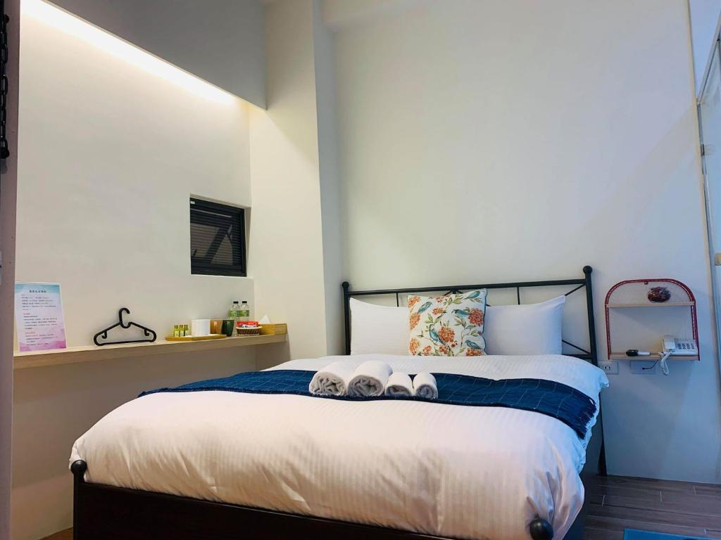 Postel nebo postele na pokoji v ubytování 日月潭沅居民宿 YUAN JU BOUTIQUE Hotel