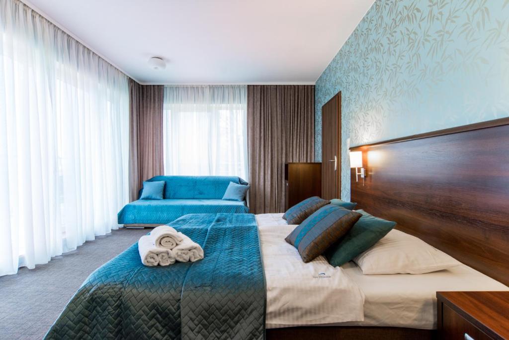 Postel nebo postele na pokoji v ubytování Villa nad Zalewem